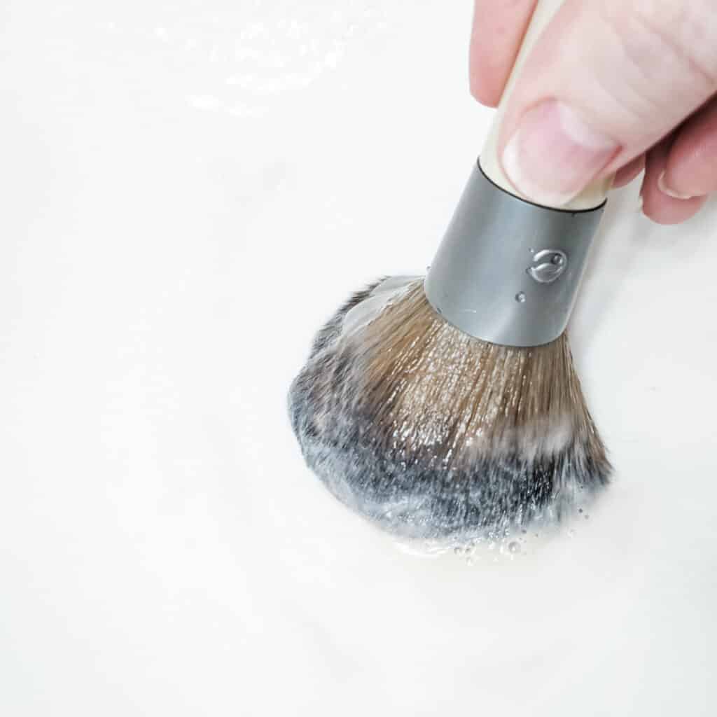 cleaning off makeup brush