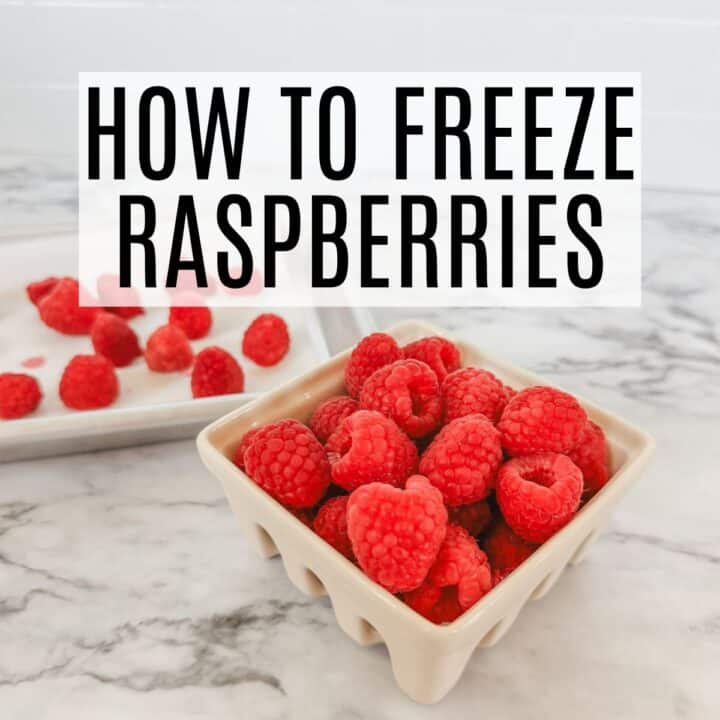 frozen fresh raspberries sitting on a countertop with words how to freeze raspberries