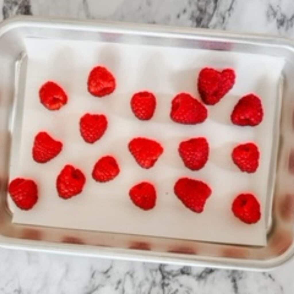 raspberries on a tray to freeze