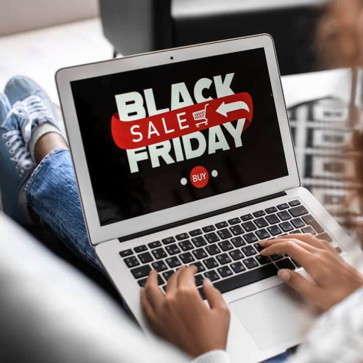 person on computer shopping black friday deals