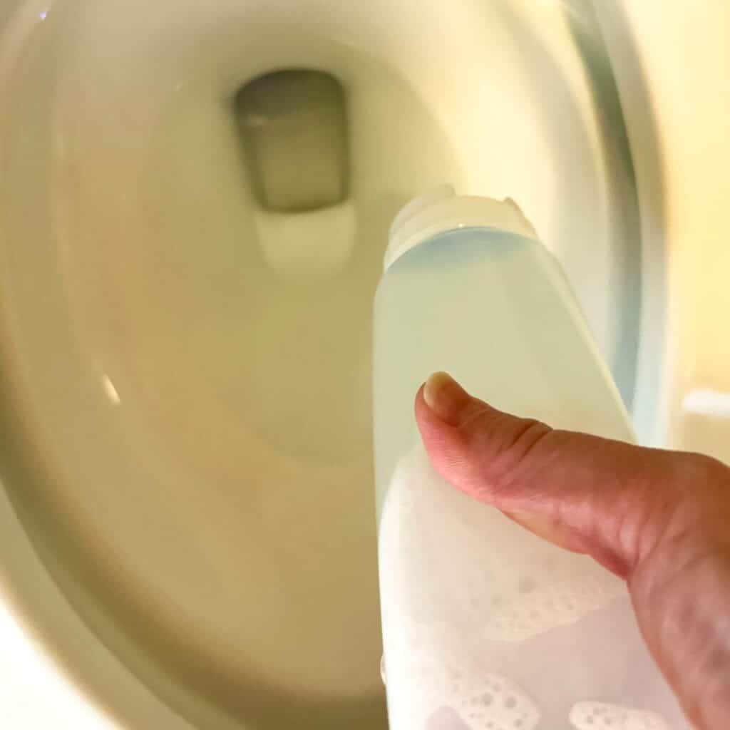 cleaning toilet bowl with homemade cleaner