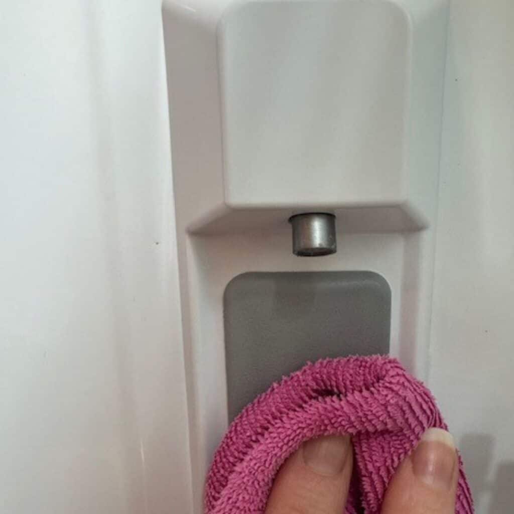 wiping down water dispenser with vinegar