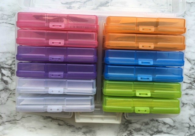 colorful containers of organized printed photos.