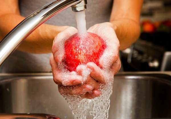 washing an apple with homemade produce wash