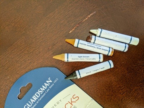 wax crayons to fix scratches in wood