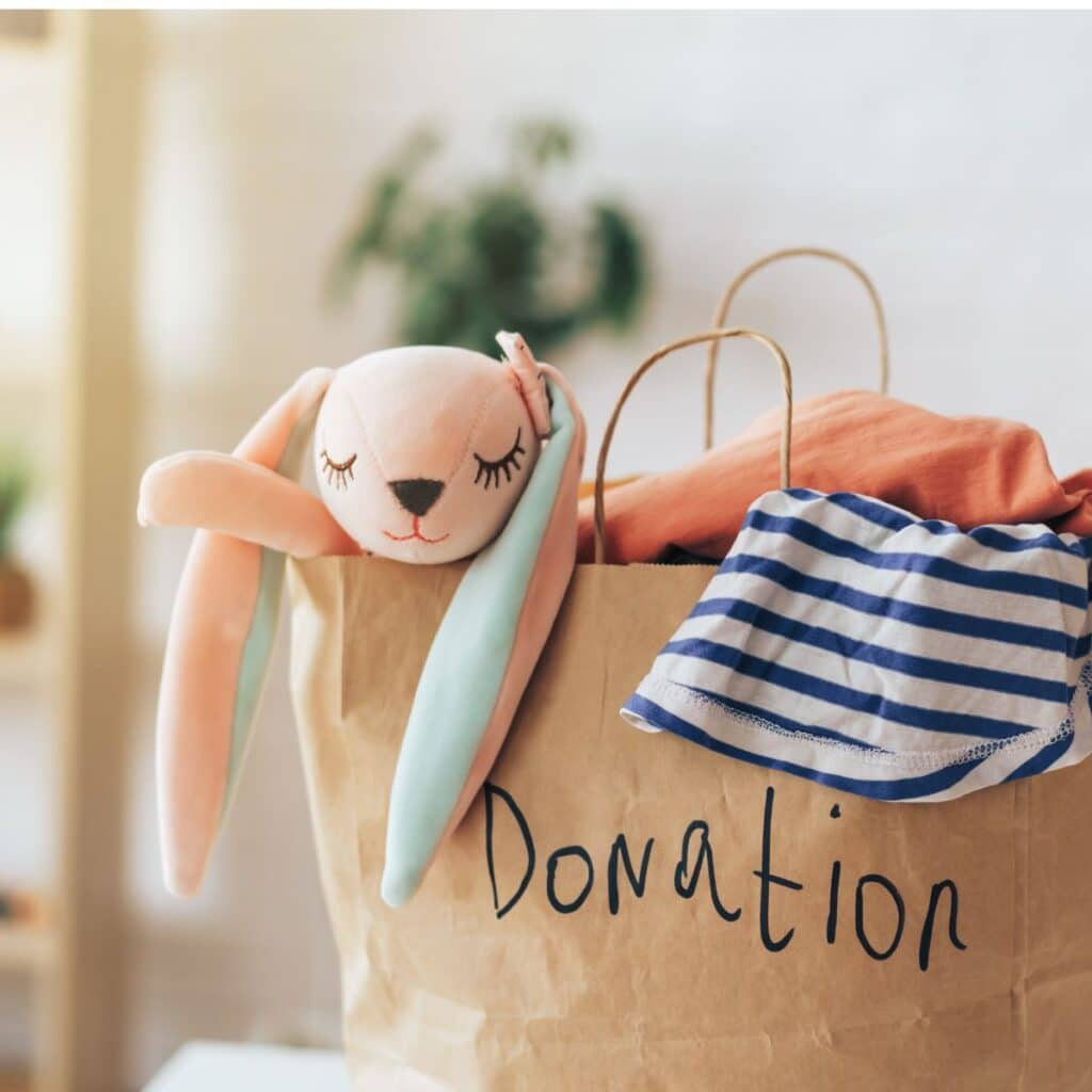 a paper bag of items that need donating after decluttering.