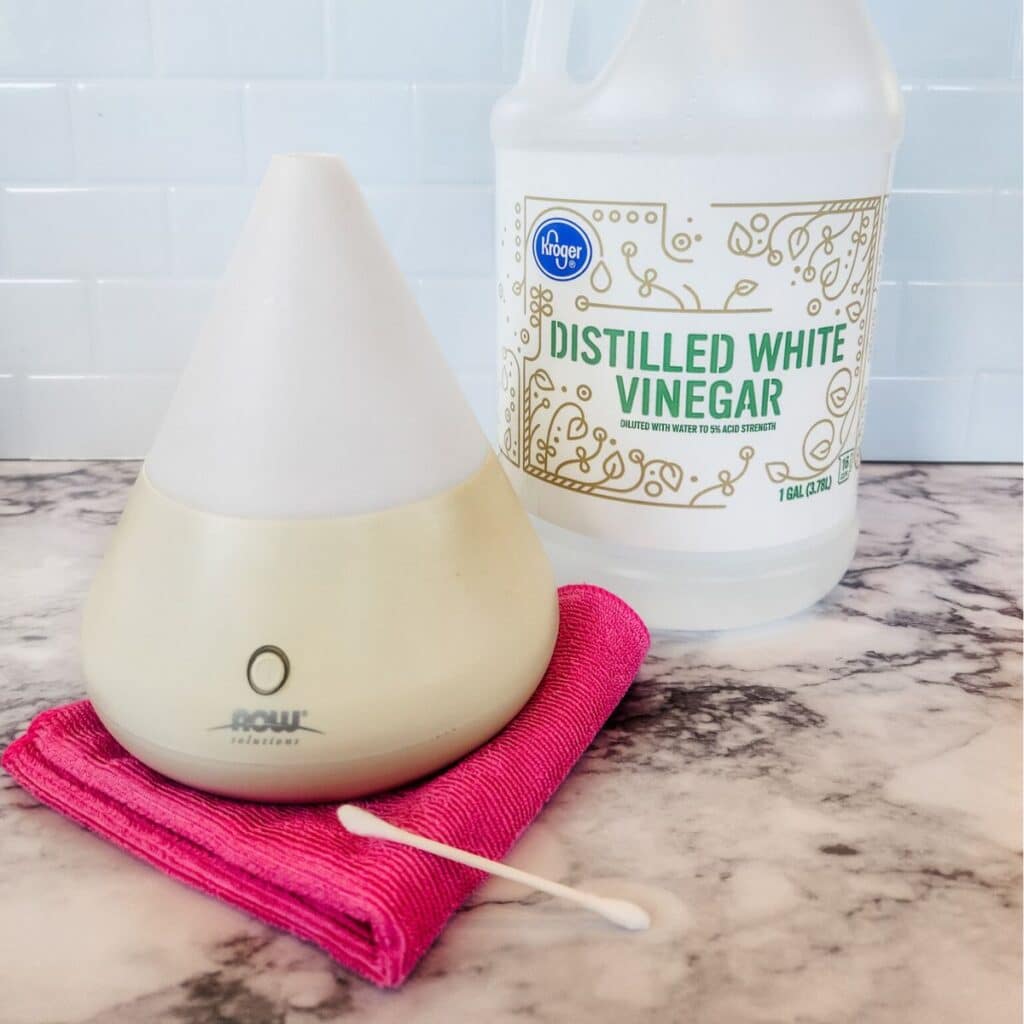 cleaning essential oil diffuser with hard water stains