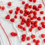 freshly washed raspberries on a kitchen towel